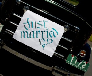 Just married on old car-crop horizontal